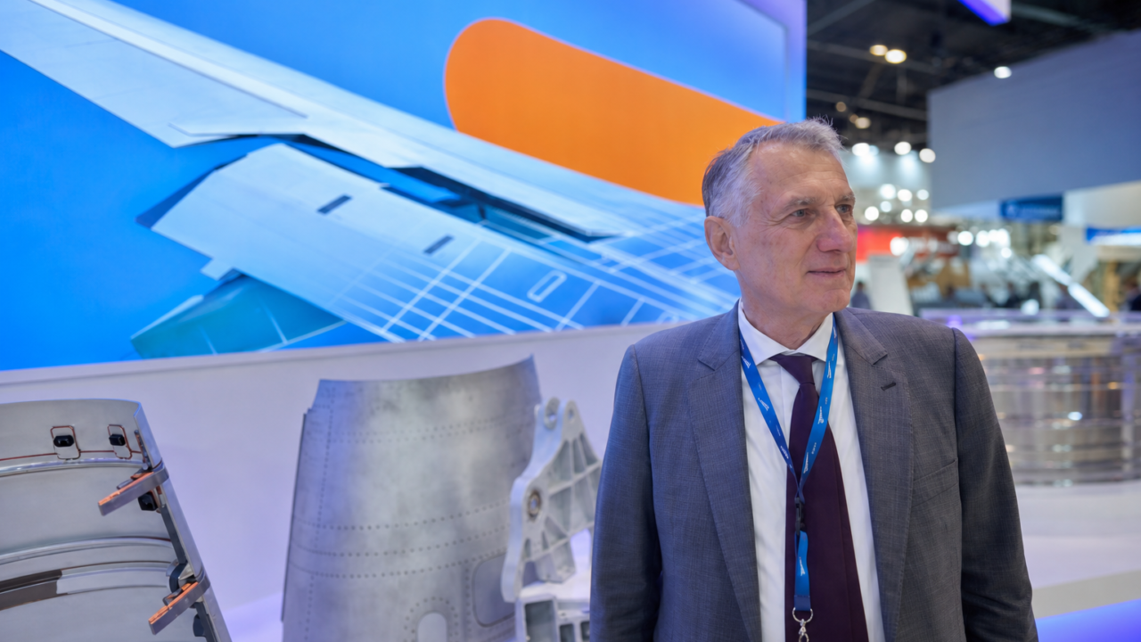 Aerospace executive at trade show booth