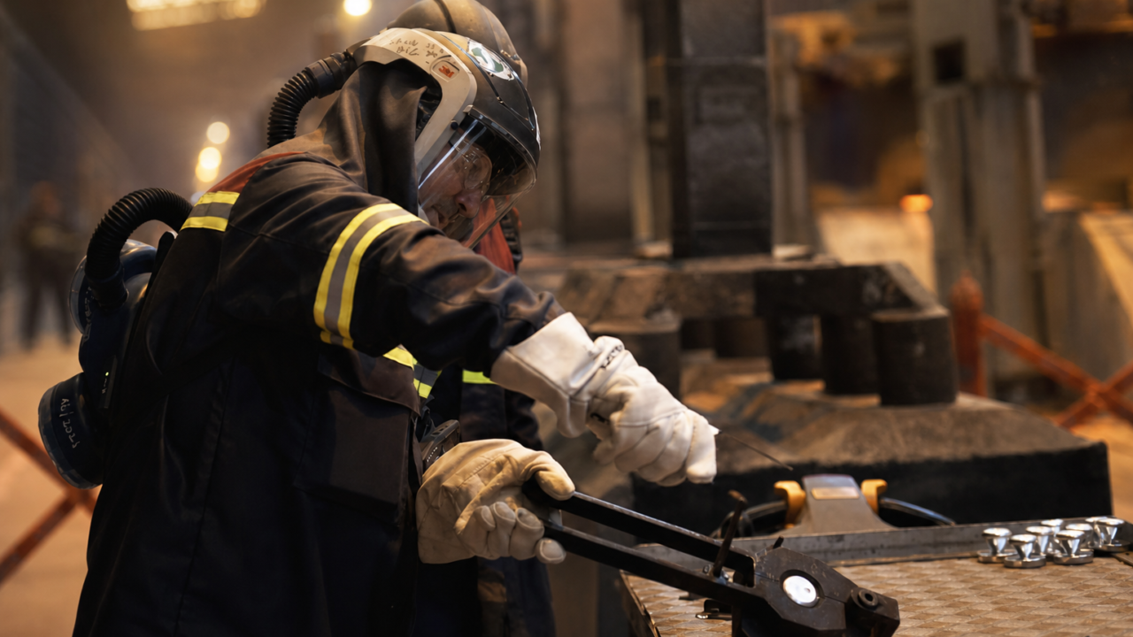 Worker in aluminum plant interior