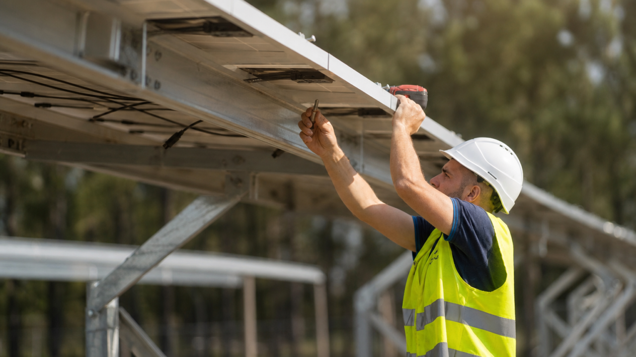 Worker maintaining solar panels